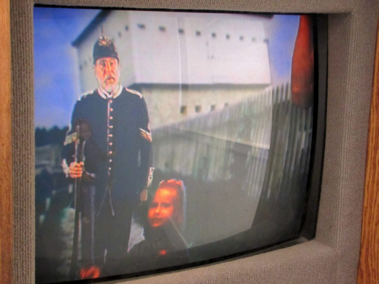 Watching the marching drill on the fort's video screen