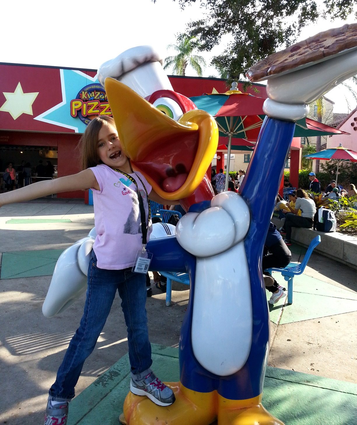 Lisa hugs the Woody Woodpecker statue
