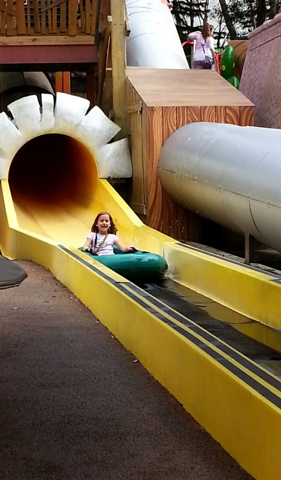 Lisa coming down the tube slide at Universal Studios
