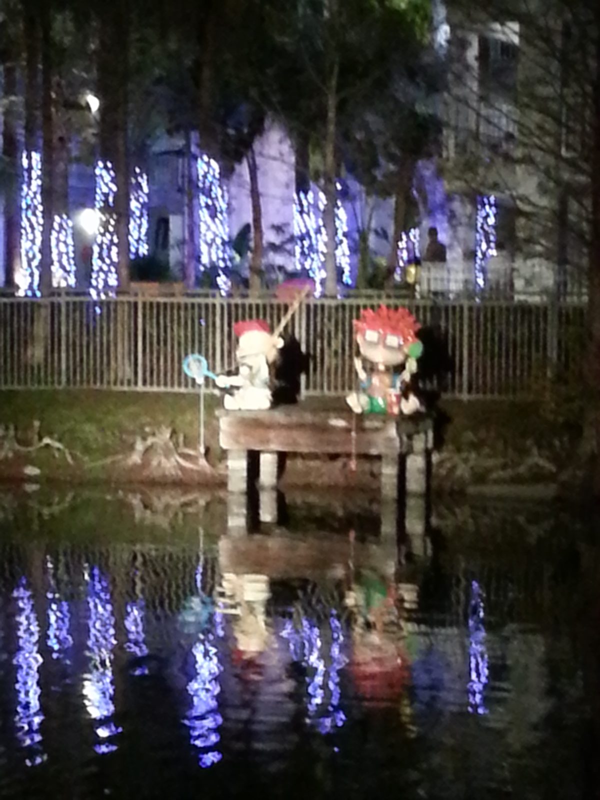 Lisa and Michael flexing with a Ninja Turtle