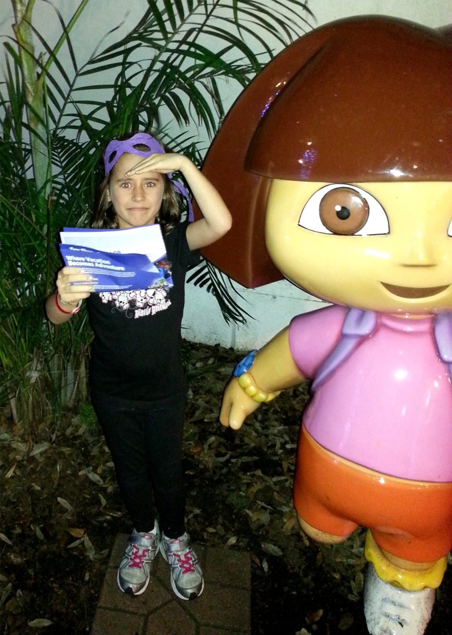 Lisa reading her map next to Dora