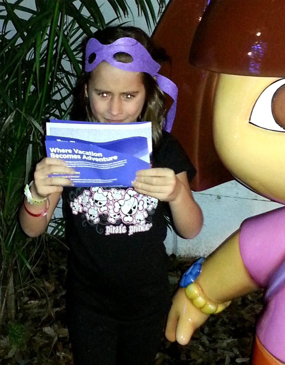 Lisa reading a brochure by the Dora statue