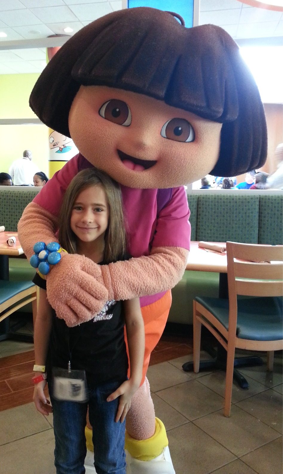 Lisa gets a big hug from Dora at breakfast at Nickelodeon Suites Resort