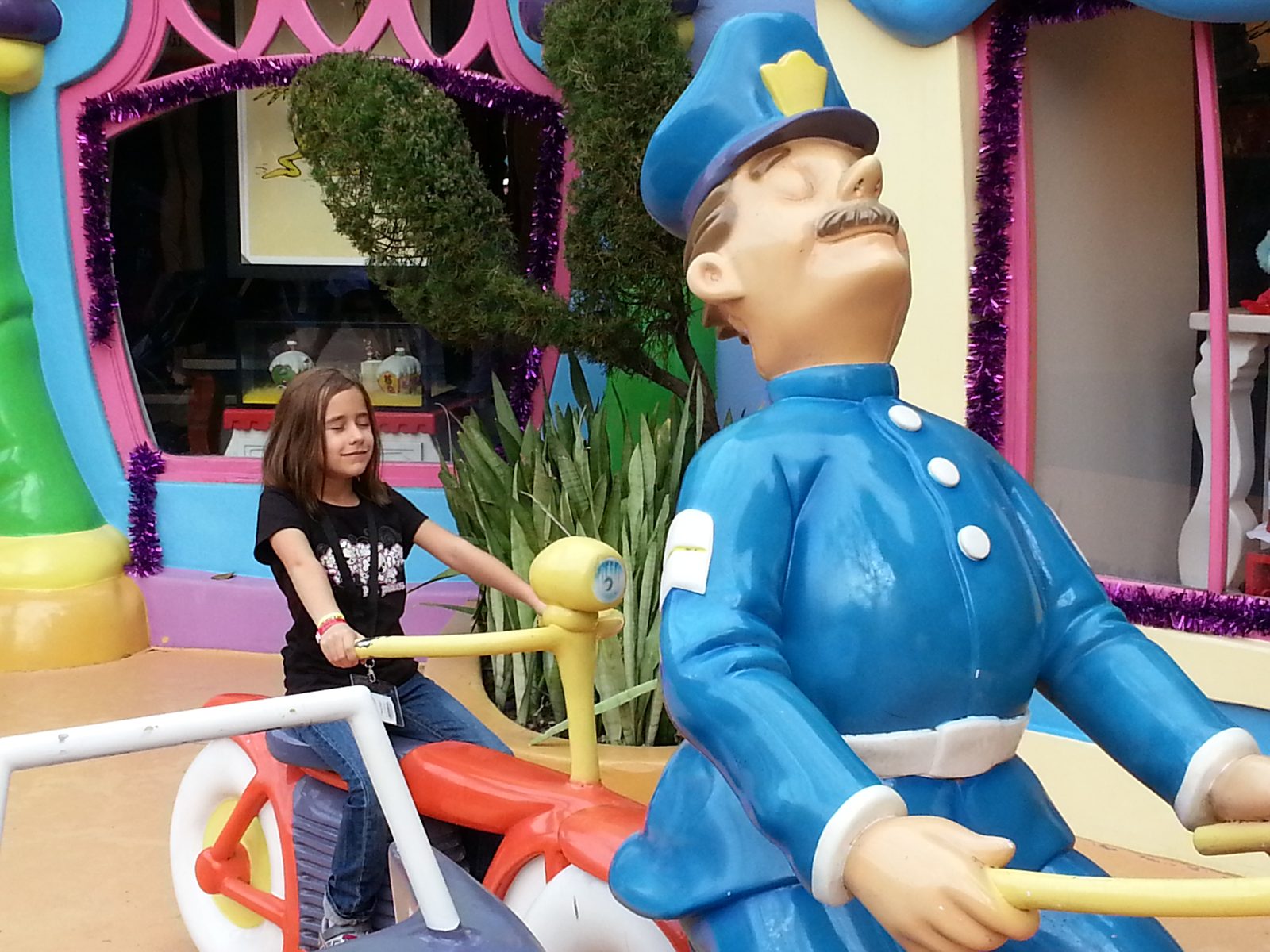 Lisa climbing the policeman's bike statue