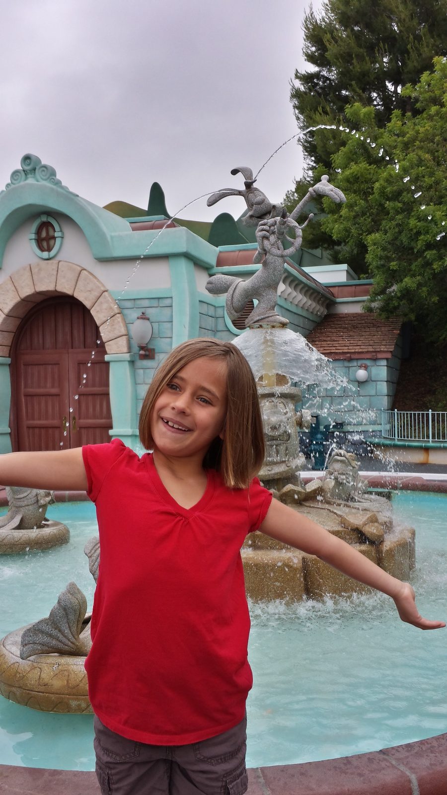 Lisa at the Chip 'n Dale fountain in Fantasyland