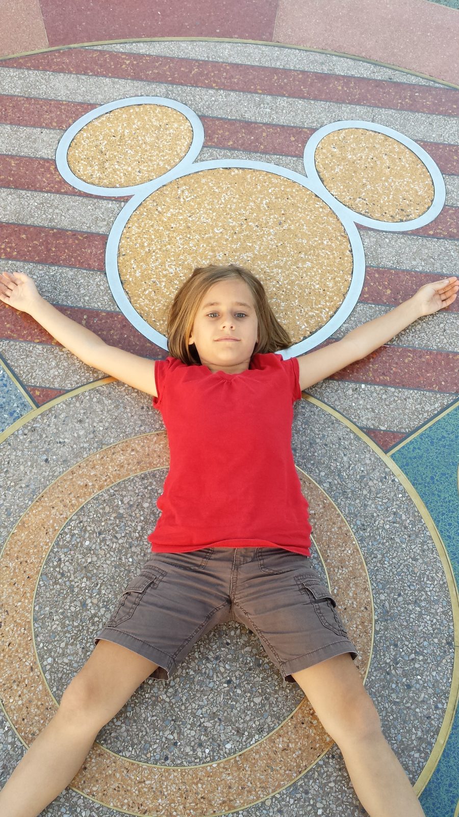 Lisa on the Mickey mosaic medallion