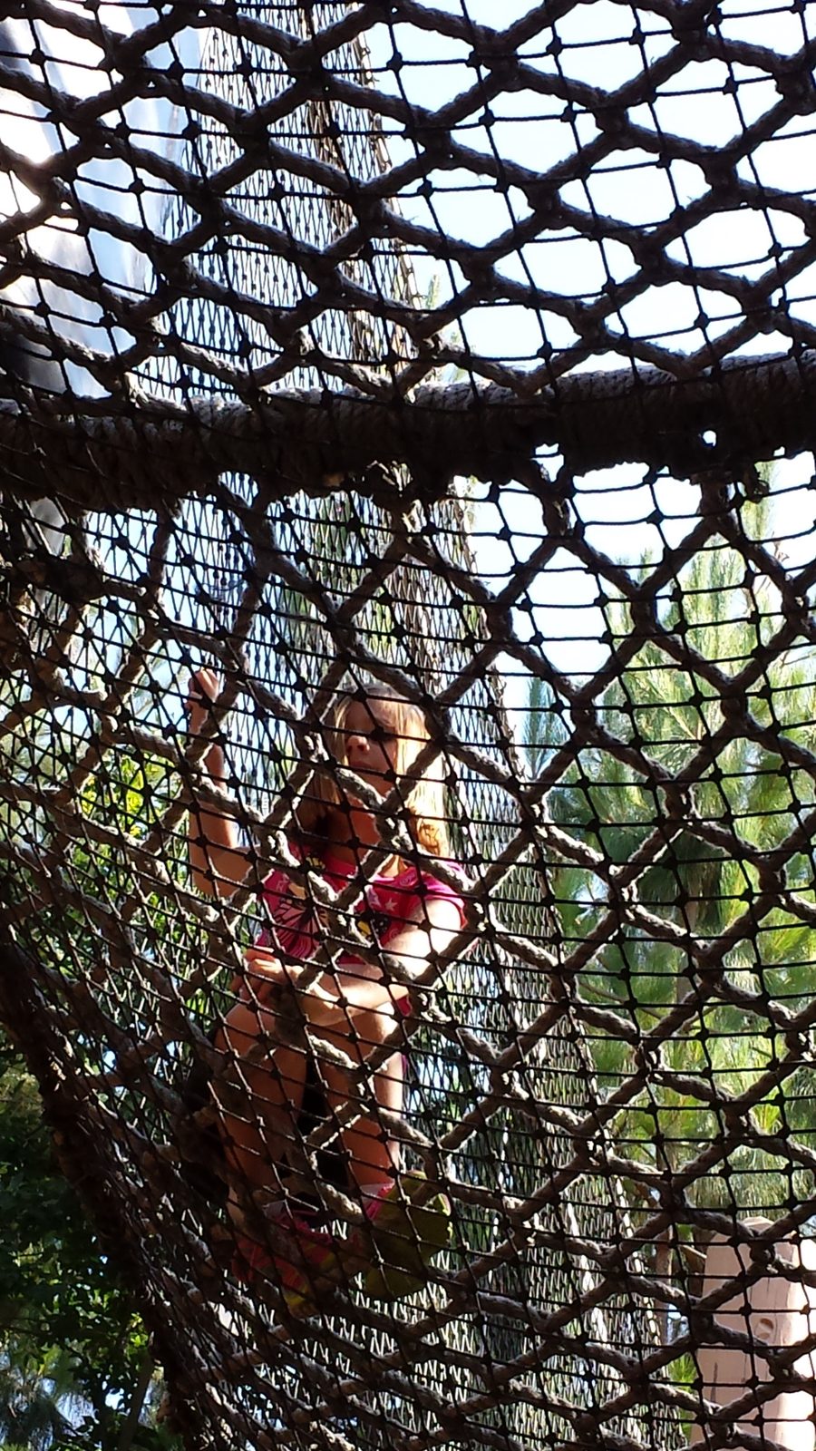 Lisa on the rope and net climbing course