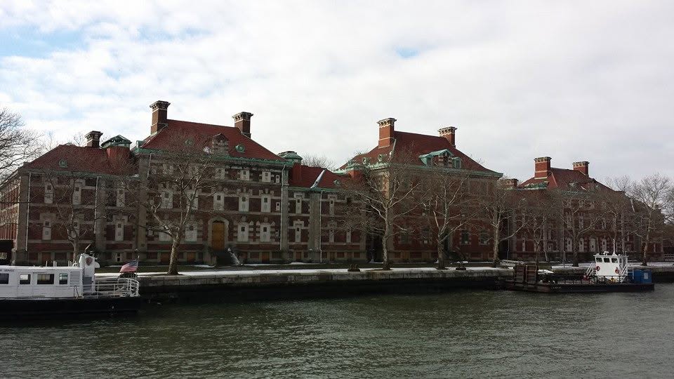 Ellis Island buildings across the water