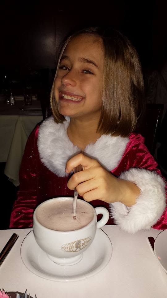 Lisa with hot chocolate at dinner after Wicked