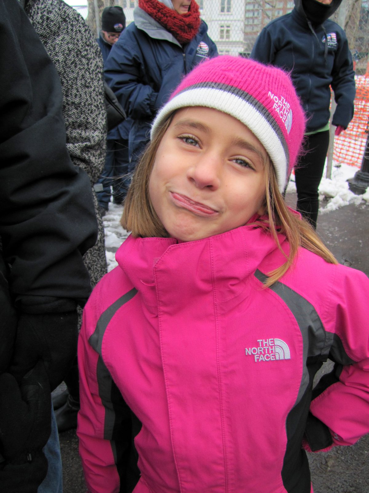 Lisa in her pink hat, making a silly face in the cold