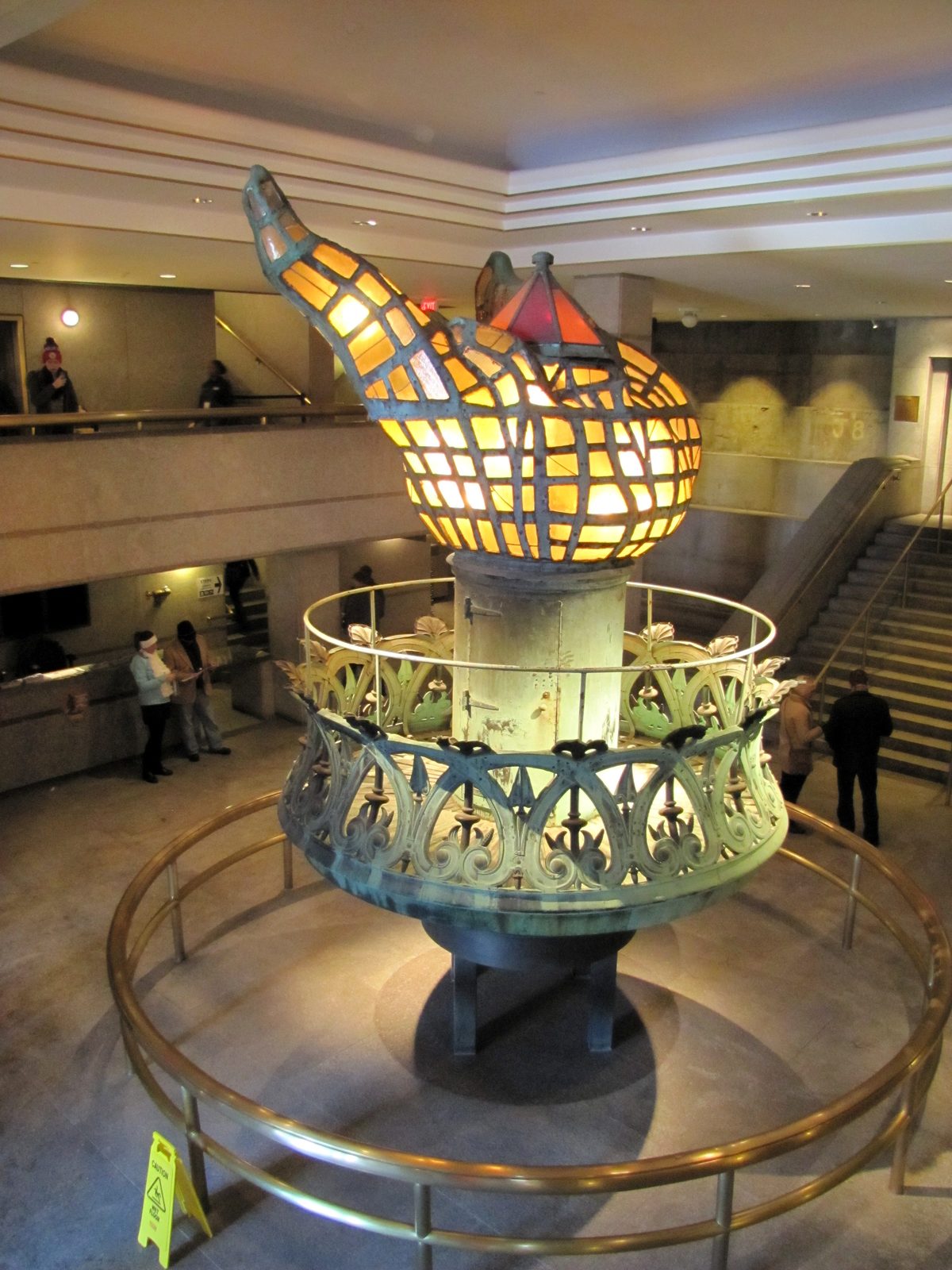 The original Statue of Liberty torch glowing inside the museum