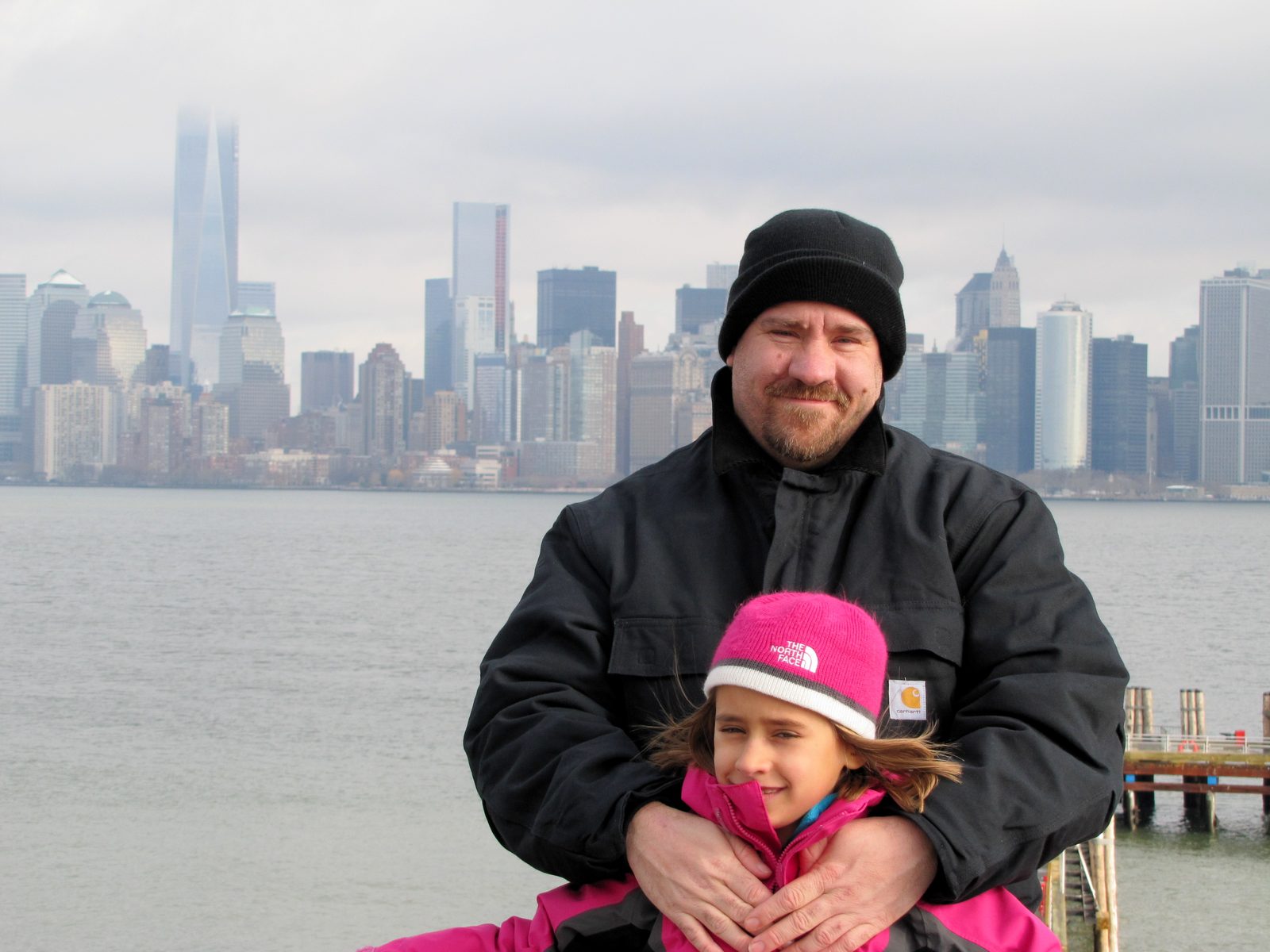 Lisa and Michael on Liberty Island with the Manhattan skyline behind us