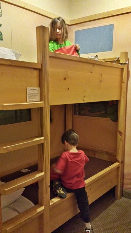 Lisa and Thomas claiming the bunk beds in our room