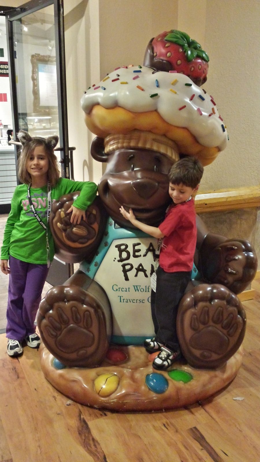 Lisa and Thomas hugging the cupcake bear at Great Wolf Lodge