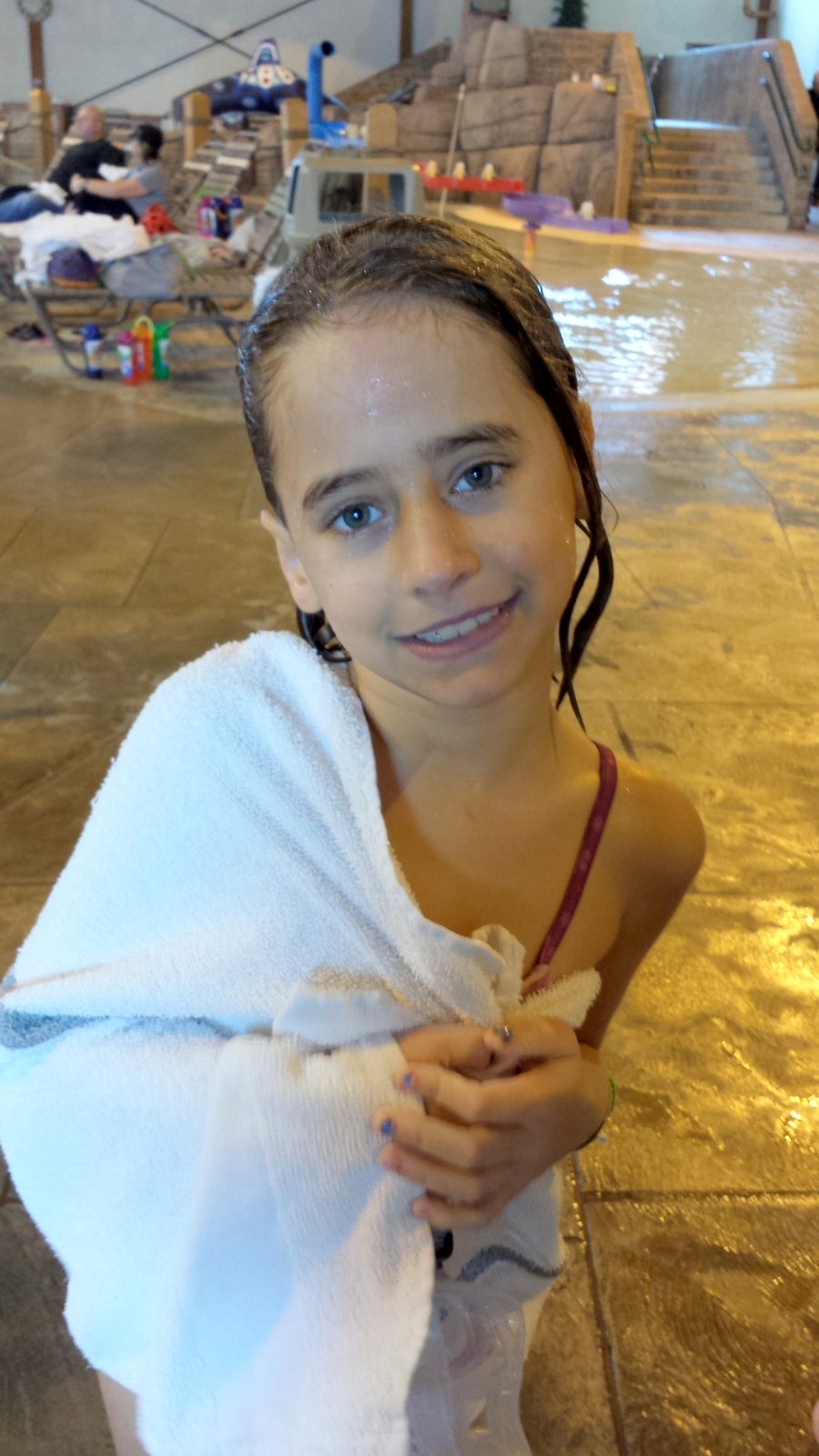 Lisa wrapped in a towel after swimming