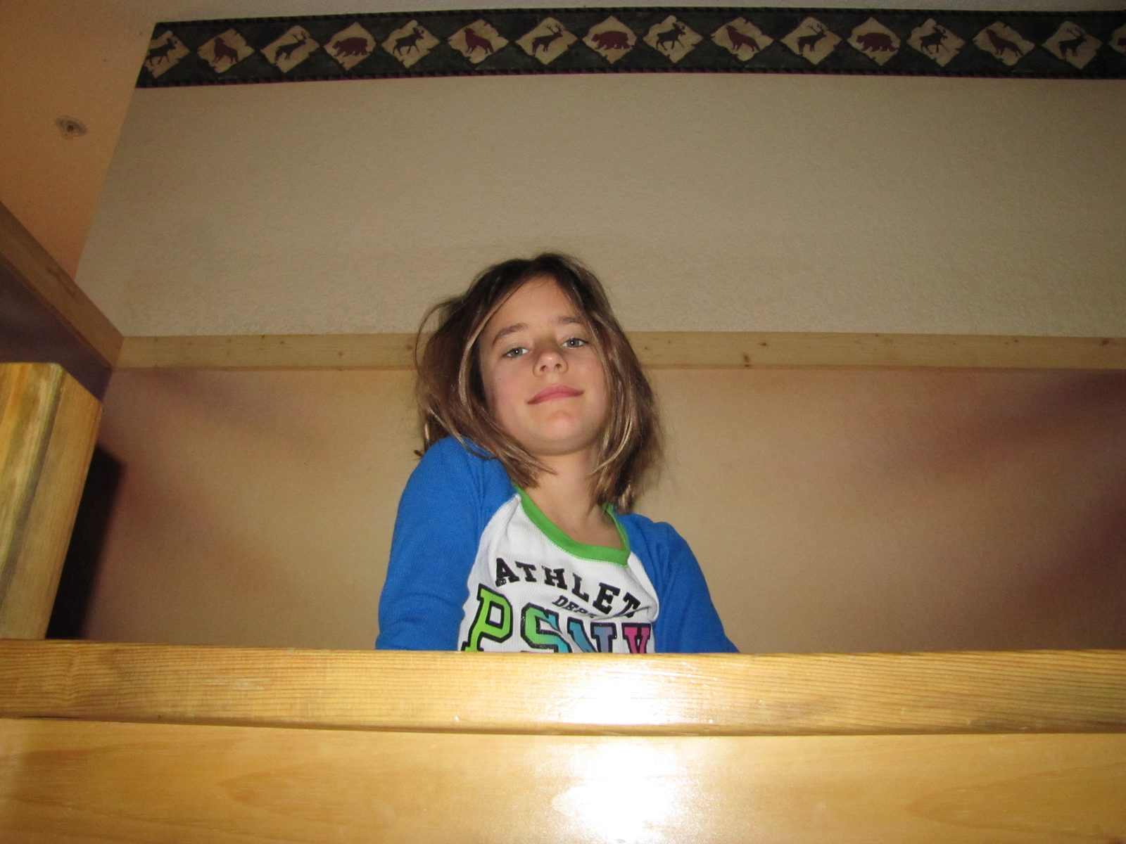 Lisa peeking over the balcony railing