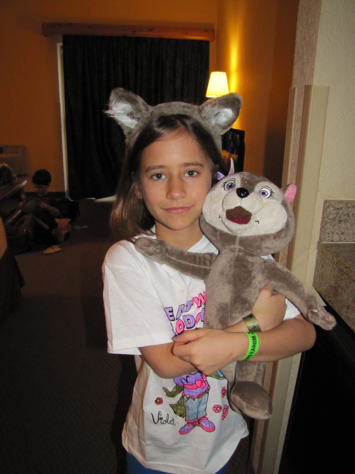 Lisa in wolf ears with her new plush