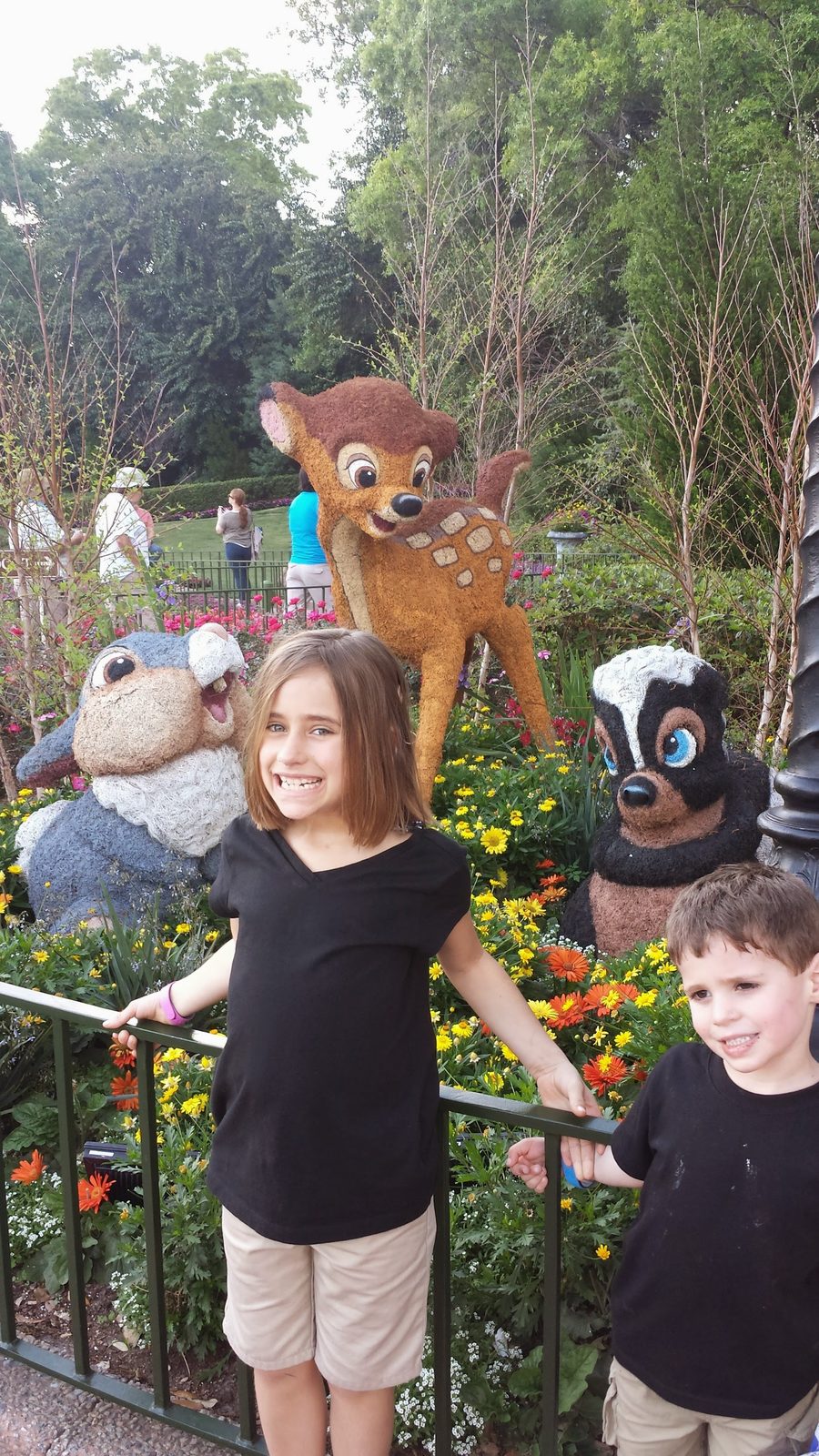 Lisa and Thomas with the Bambi topiaries at Epcot