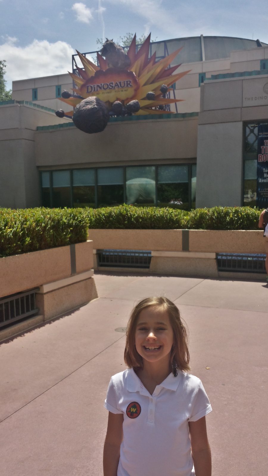 Lisa outside the Dinosaur ride in DinoLand