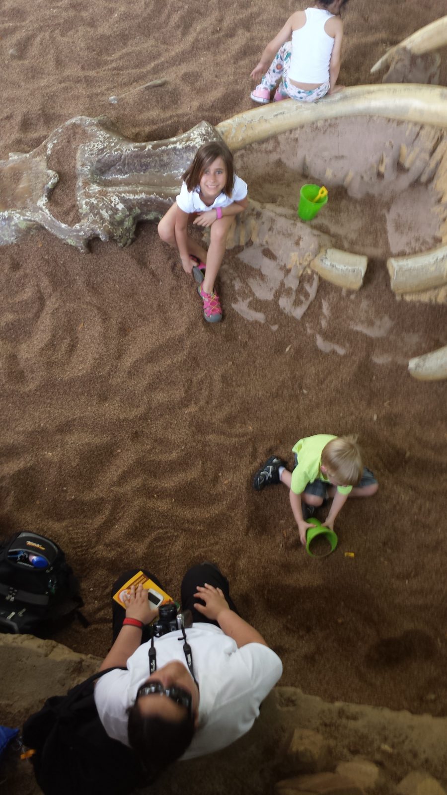 Lisa digging at the Boneyard in DinoLand