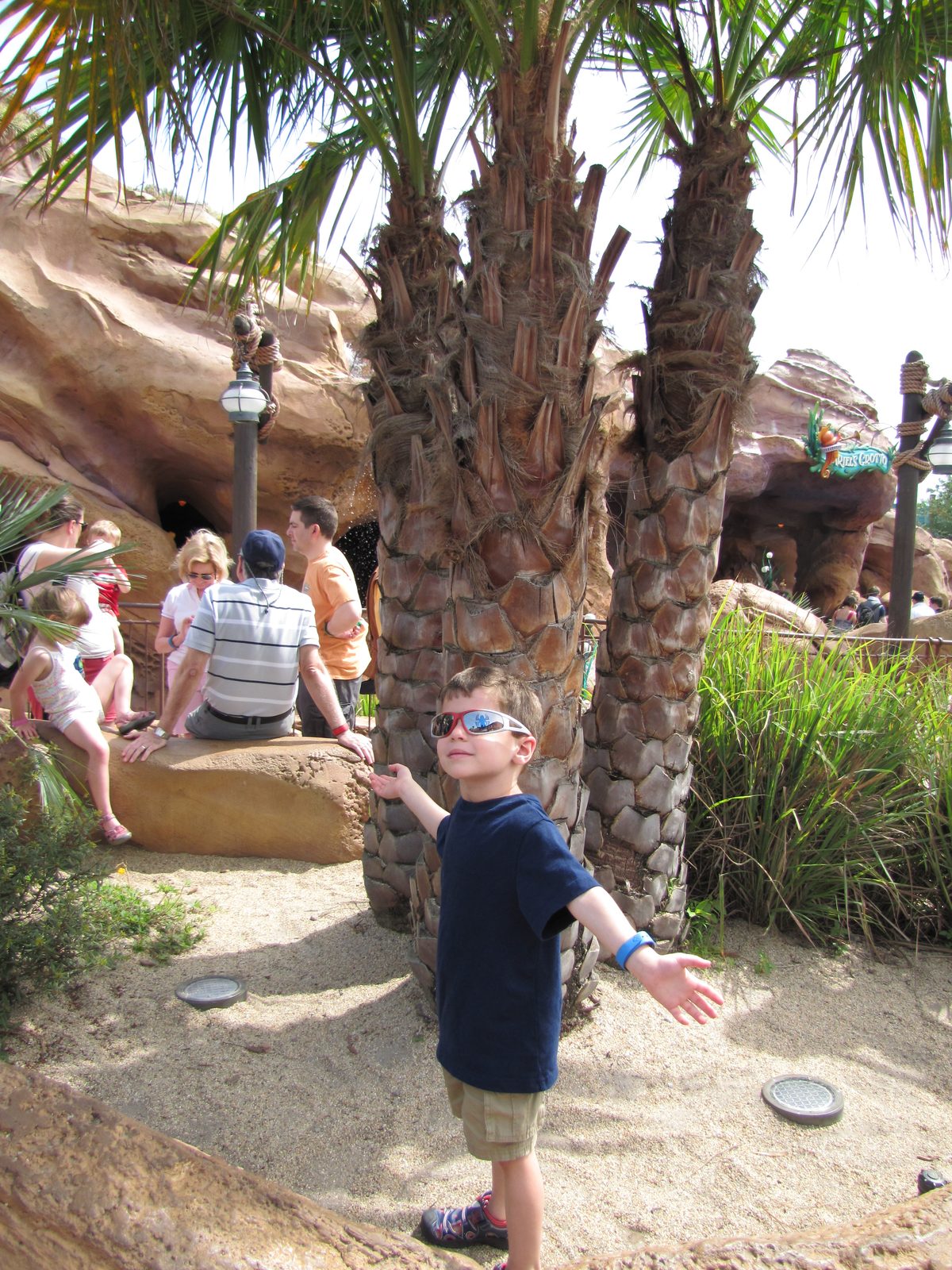 Thomas striking a pose among the palms