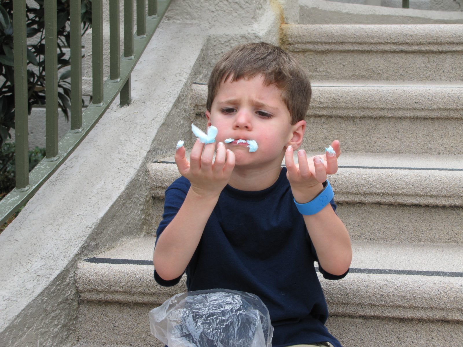 Thomas's tired snack break on the castle steps
