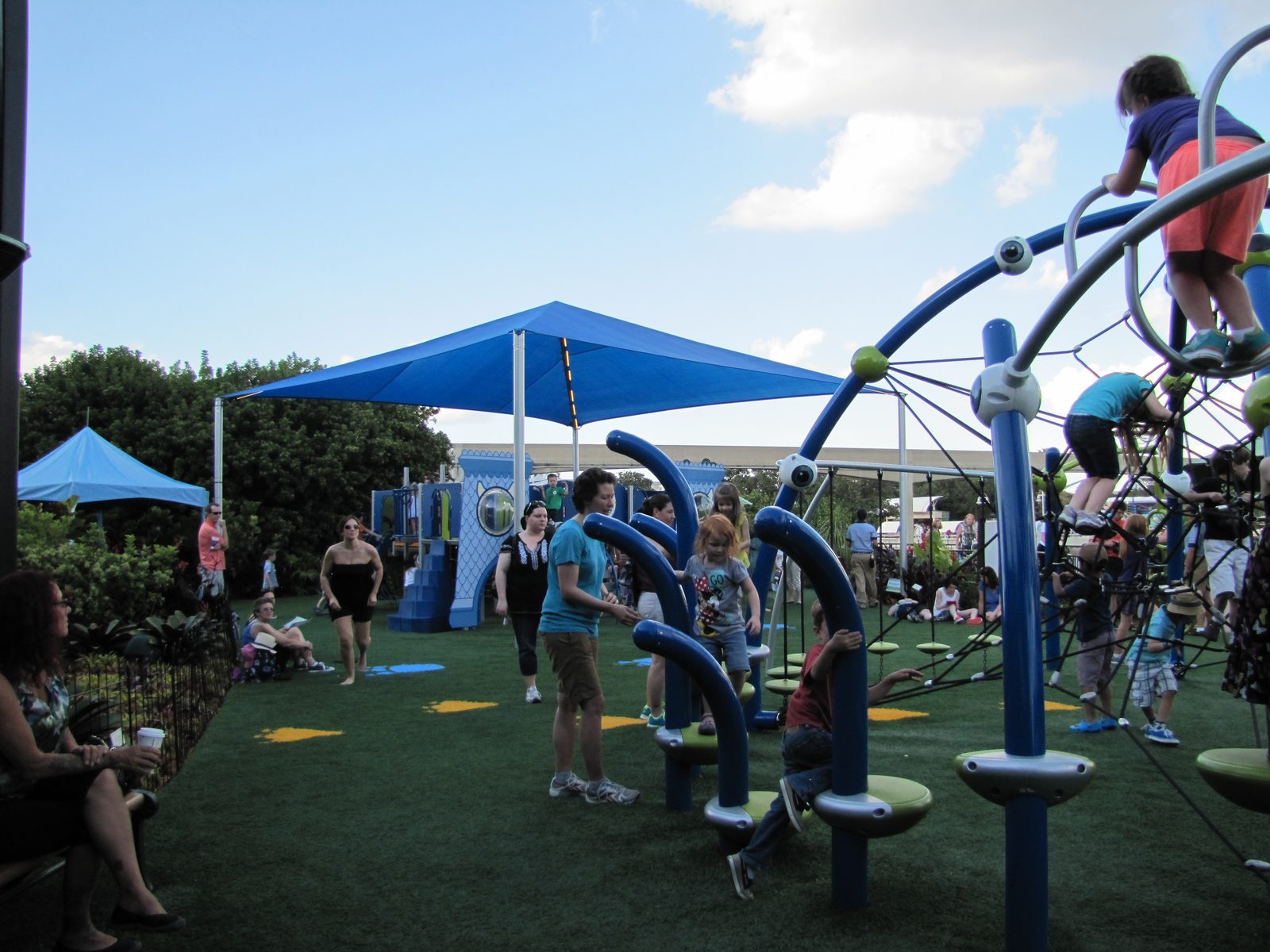 The kids climbing the playground near World Showcase