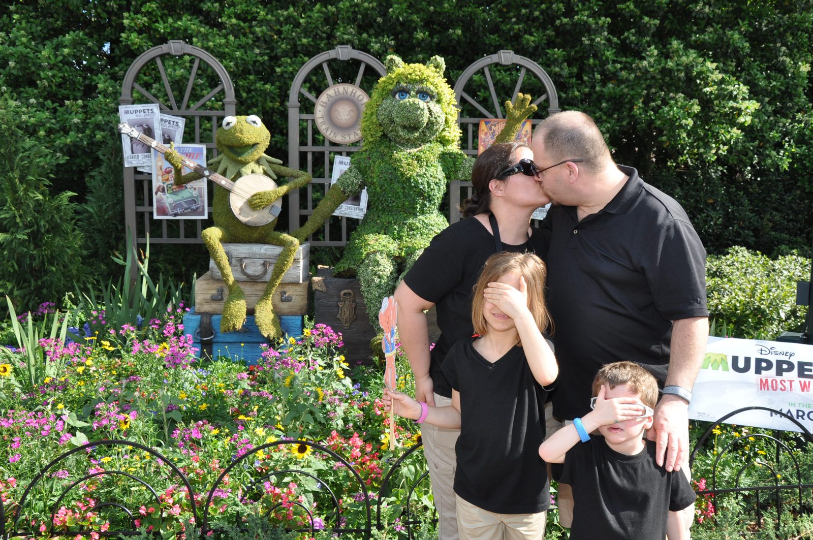 Kathy and me sharing a kiss by the Muppets garden