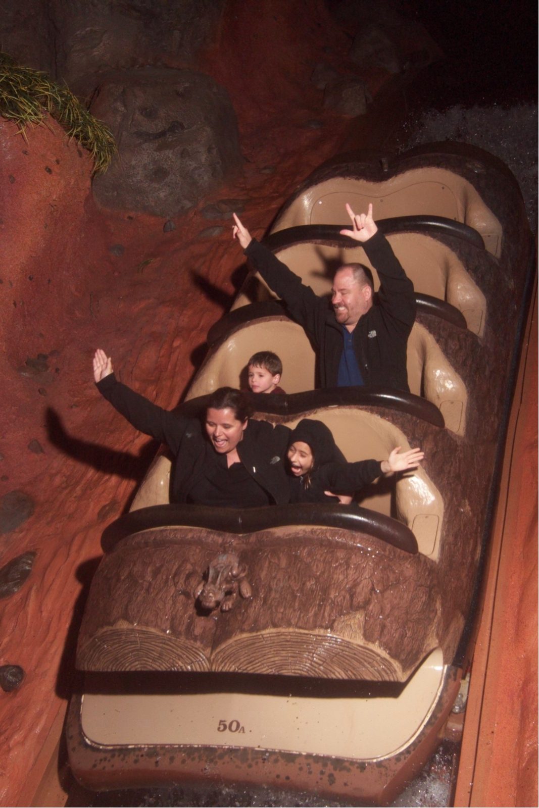 Thomas's first ride down Splash Mountain, arms up
