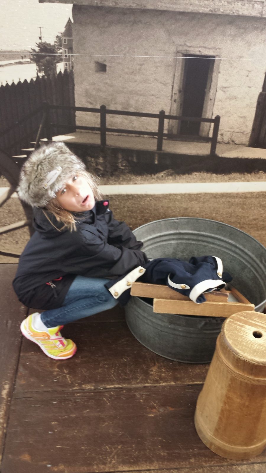 Lisa tries the pioneer washtub and churn