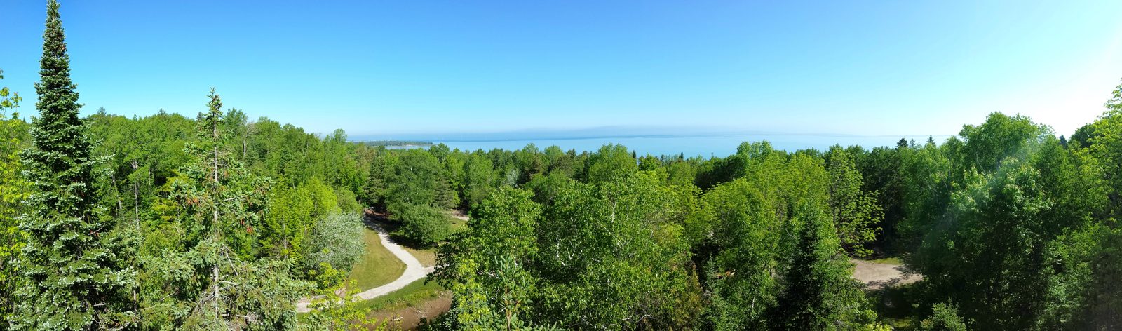 Treetops open up toward Lake Huron