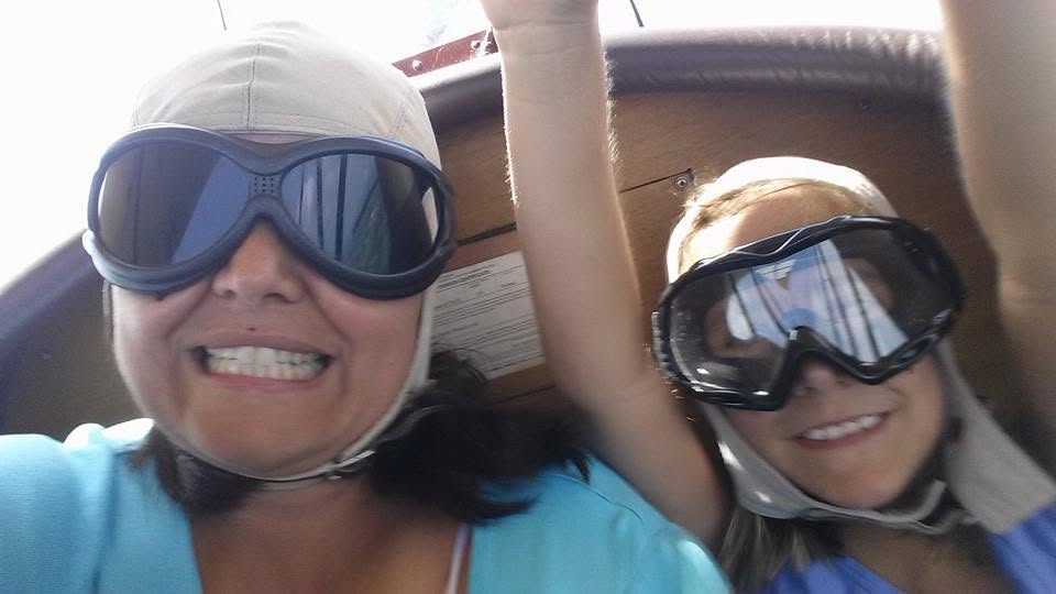 Kathy and Lisa in the open cockpit of the biplane