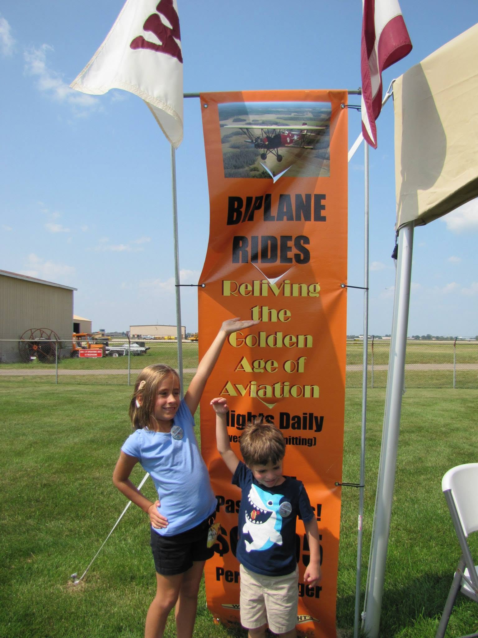 Lisa and Thomas at the biplane rides banner