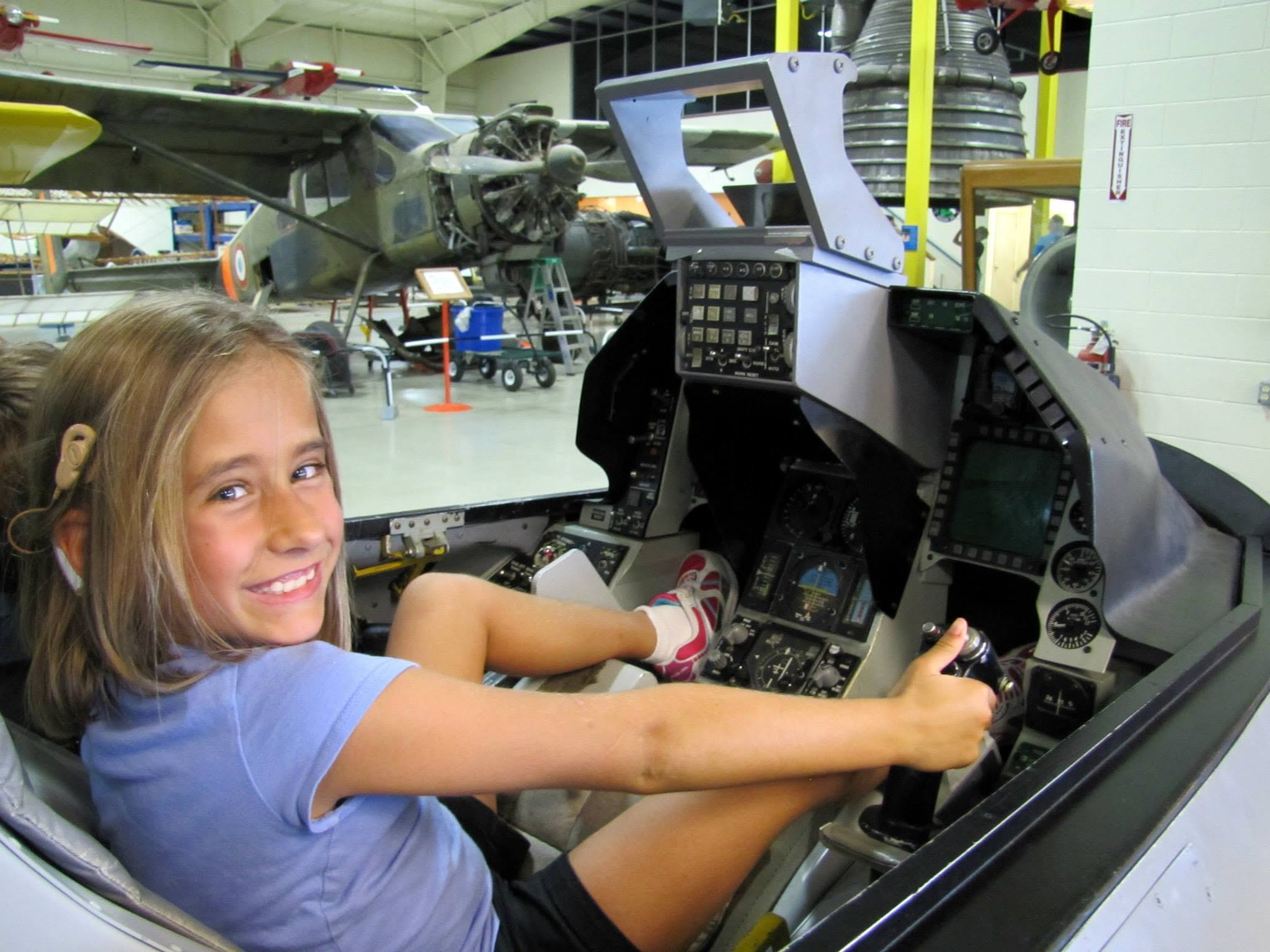 Lisa at the controls of a fighter jet