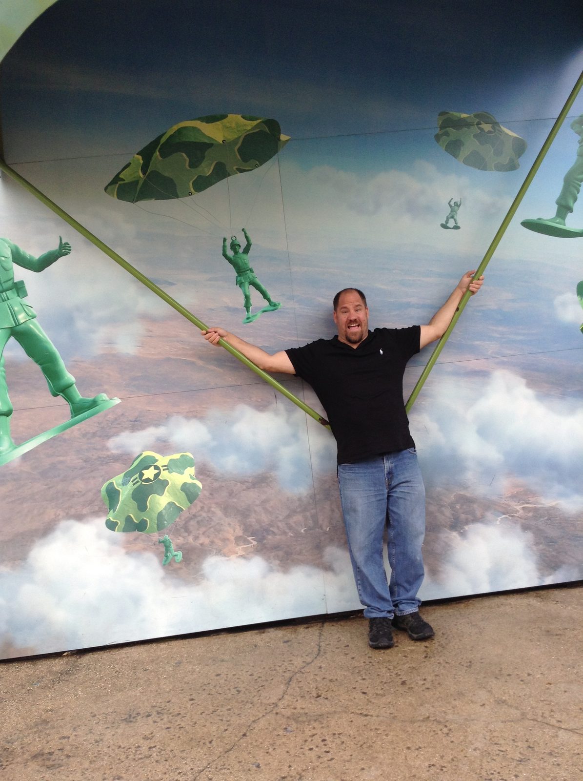 Michael hanging from Andy's Toy Story parachute wall