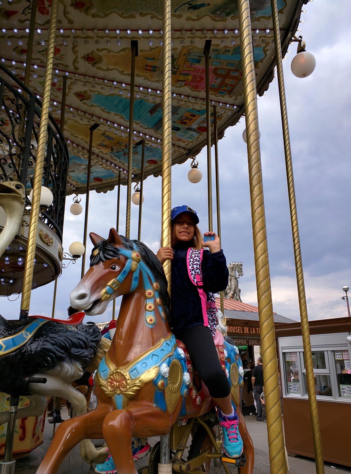 Lisa on the carousel by the tower