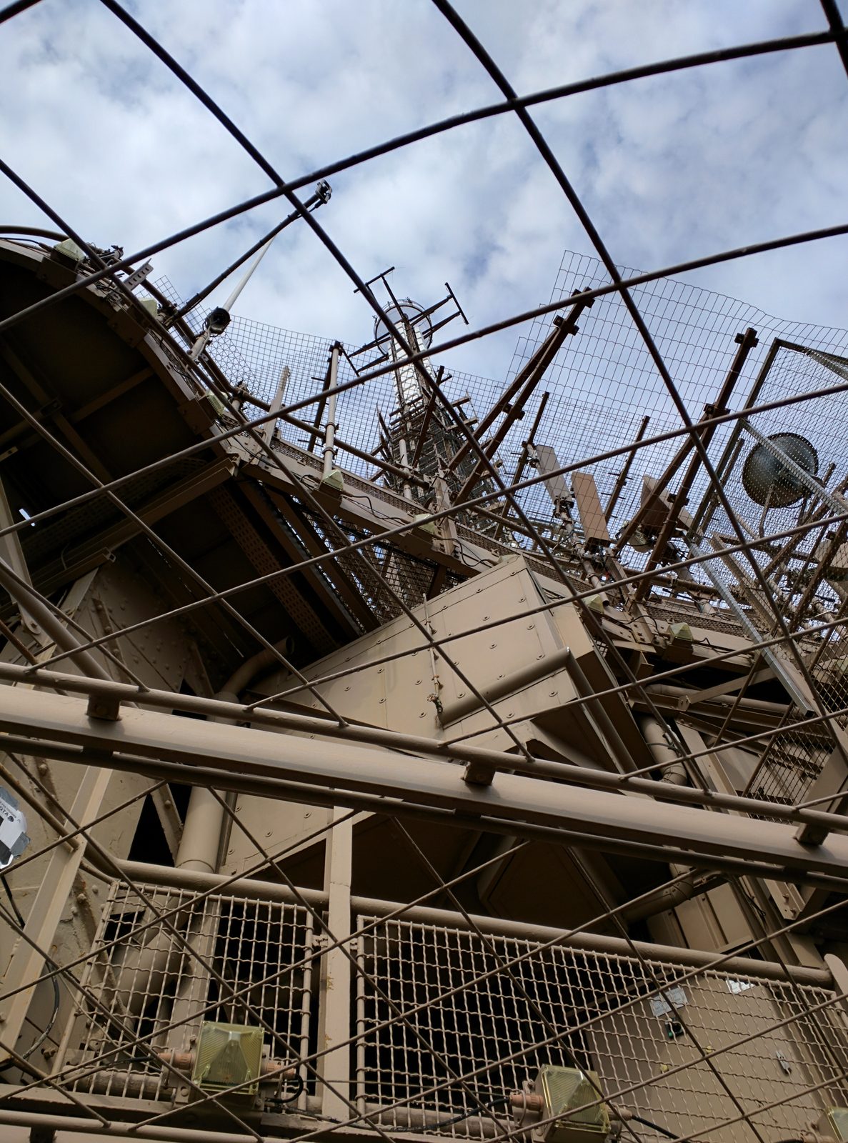 Looking up through the Eiffel Tower's ironwork