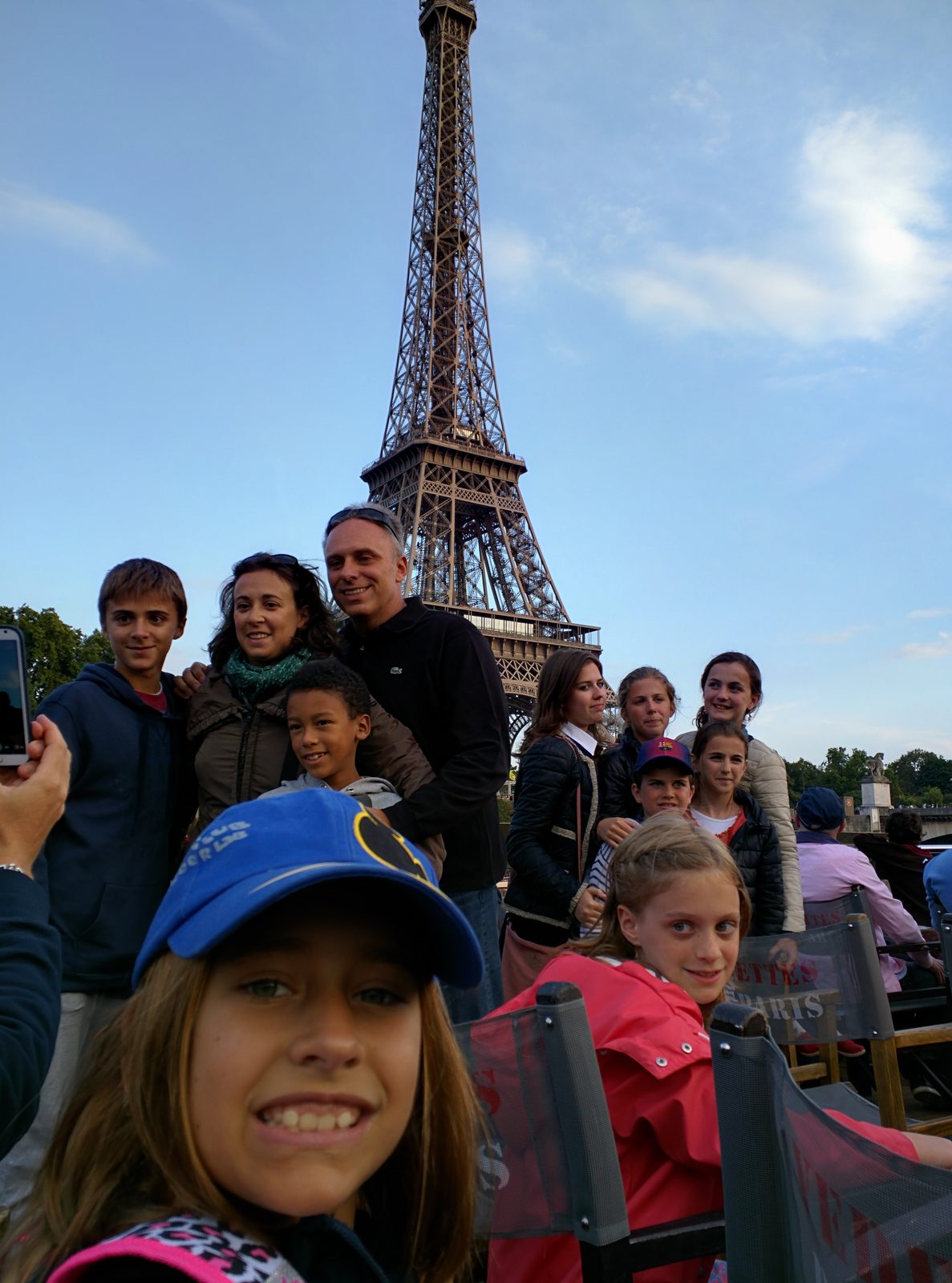 Lisa on the Seine cruise with the Tower behind