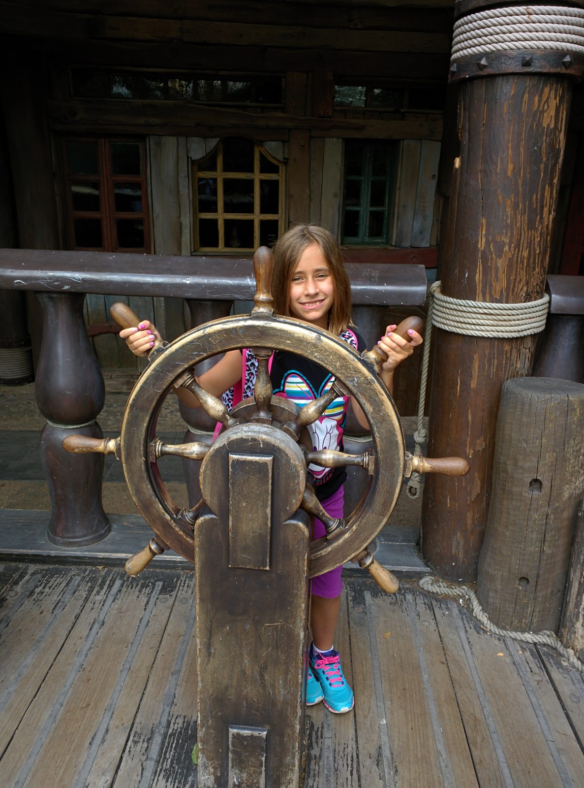 Lisa at the wheel of the pirate ship