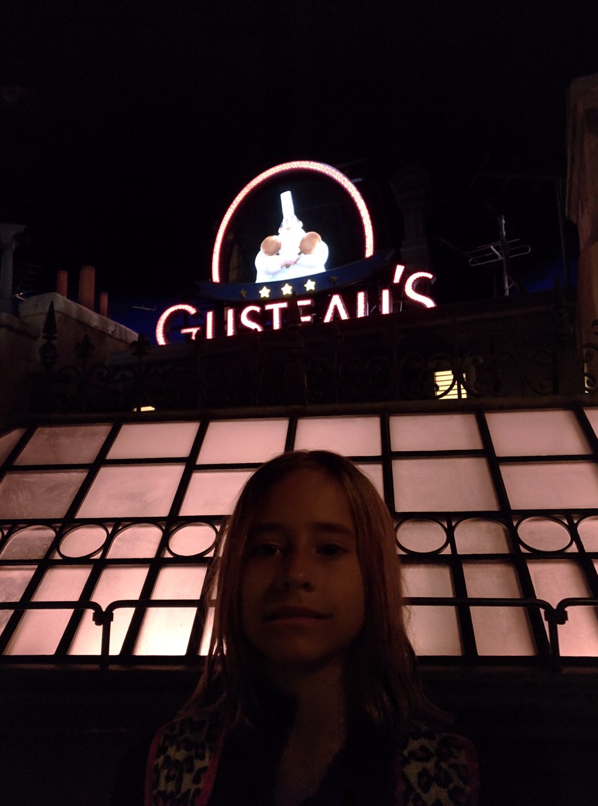 By the Gusteau's sign for Ratatouille