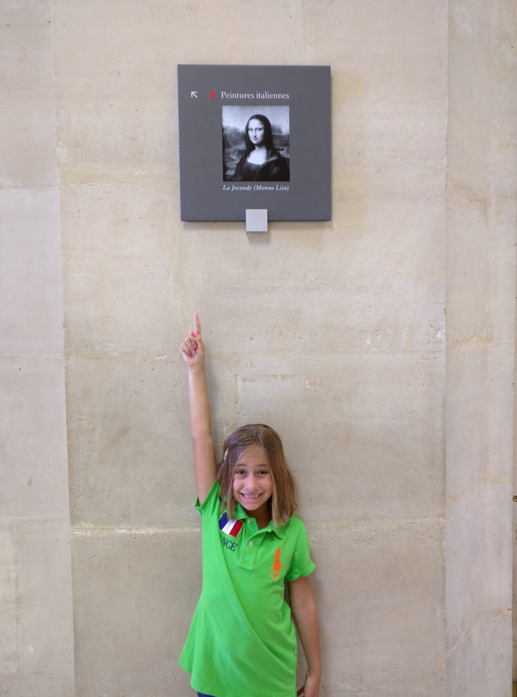 Lisa pointing out the Mona Lisa
