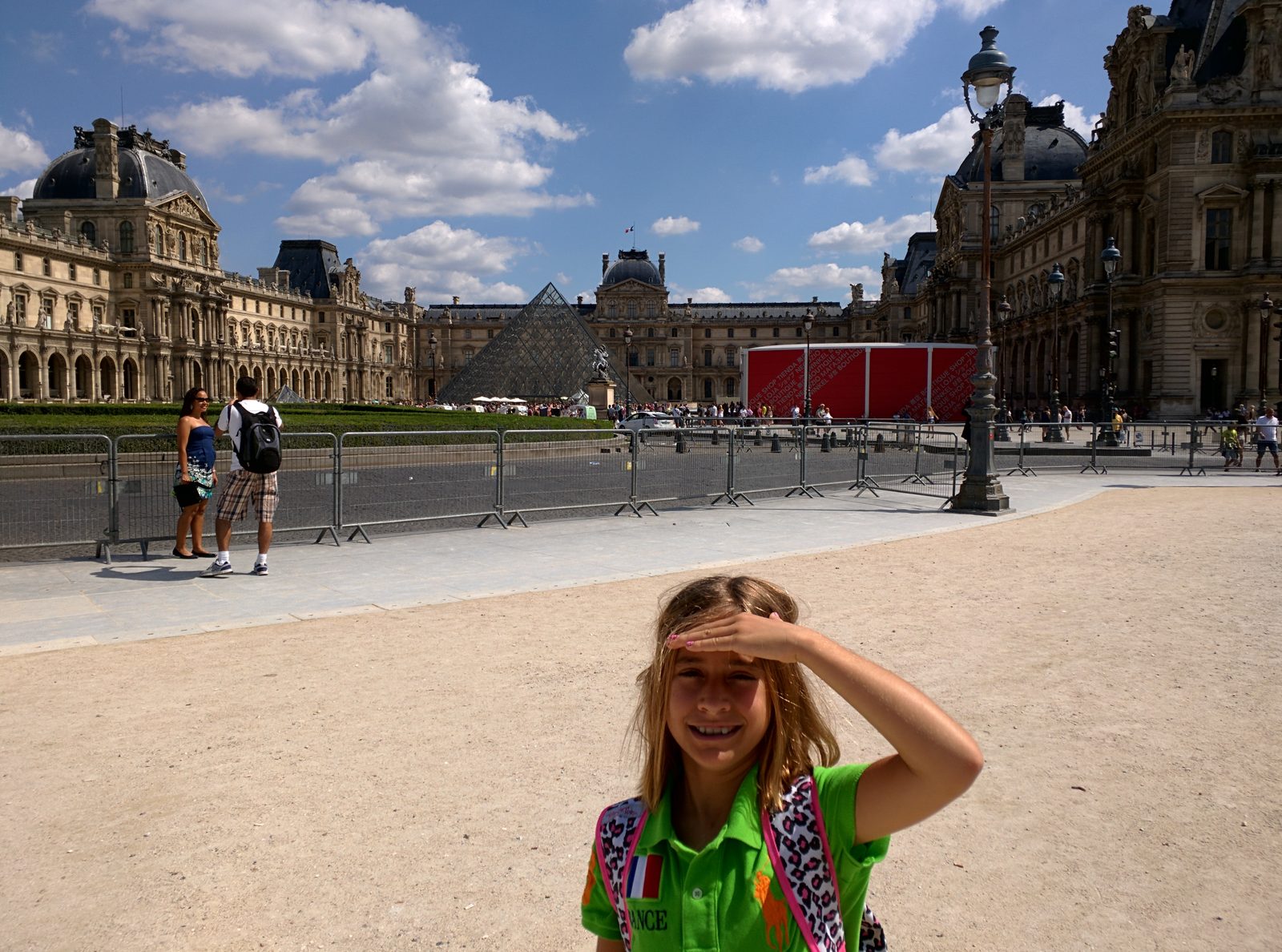 Lisa with the Louvre and the pyramid behind