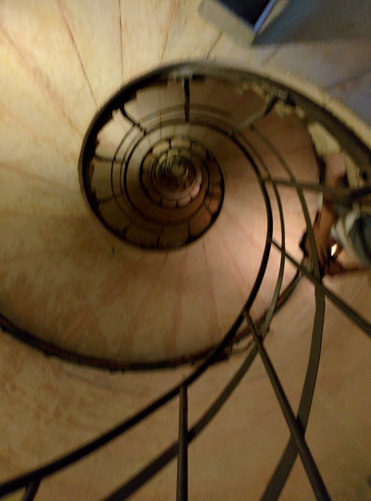 The spiral stairs down from the top