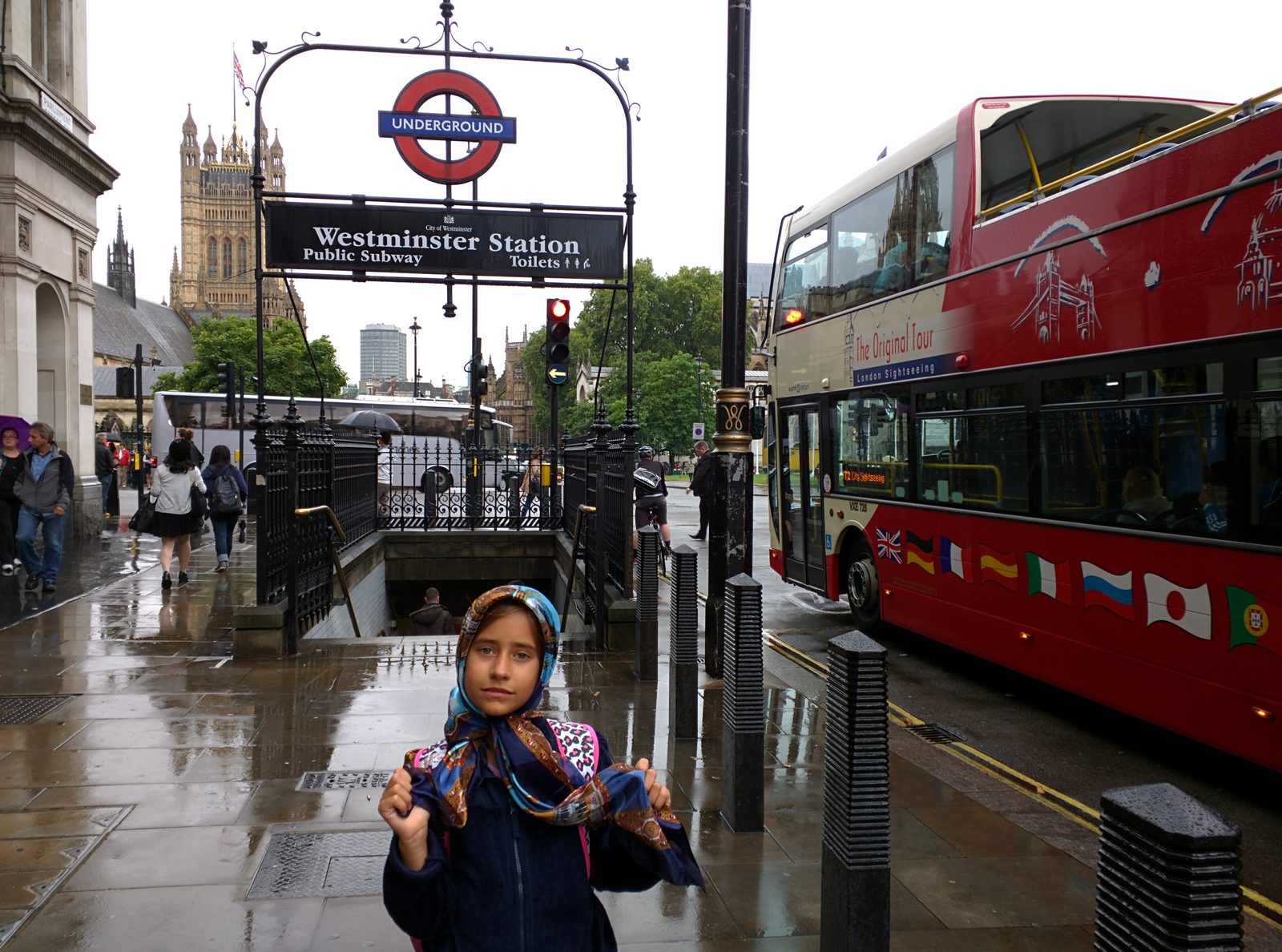 Lisa outside Westminster Station in the rain