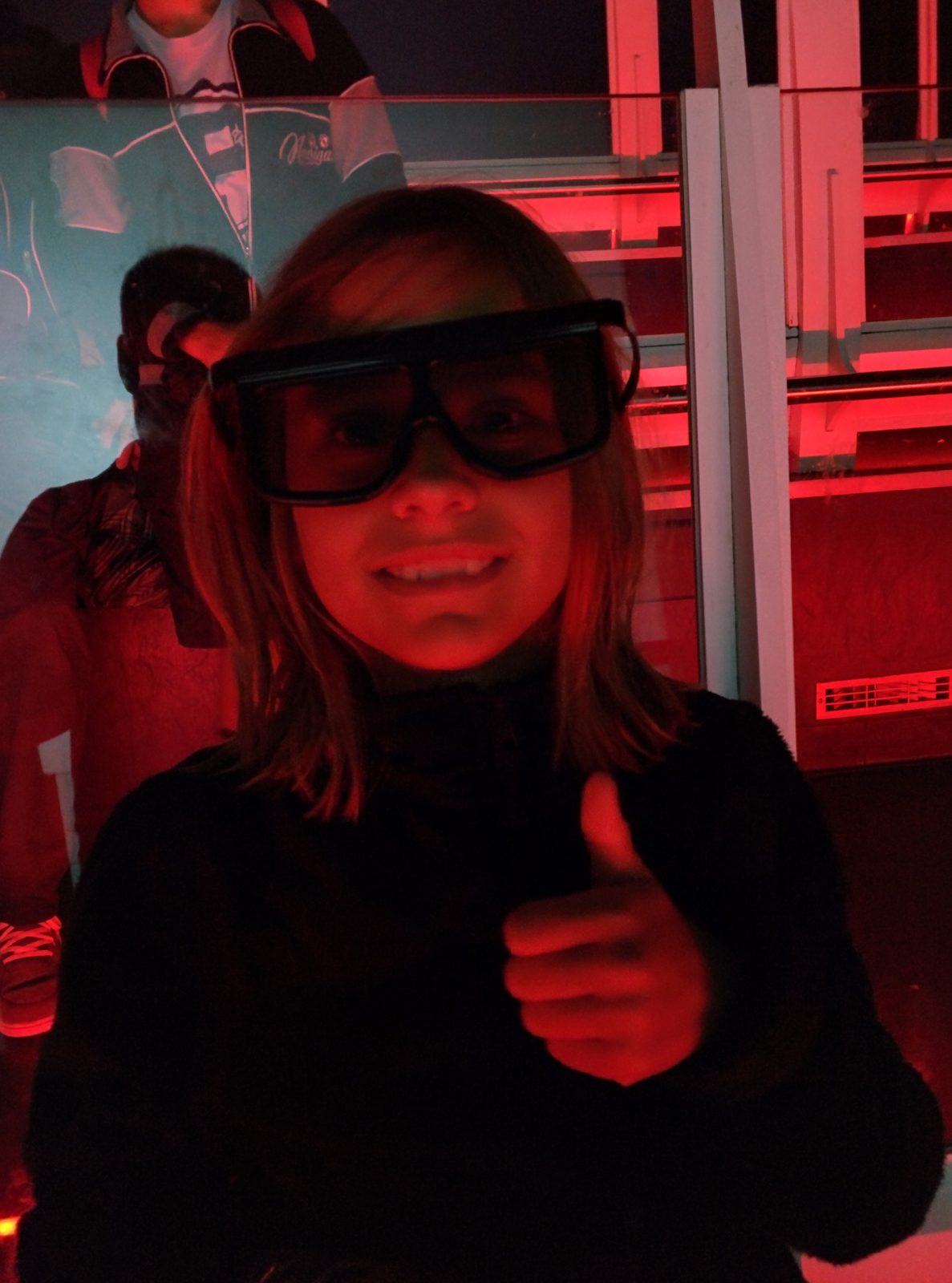 Lisa in 3D glasses at Shrek's Adventure