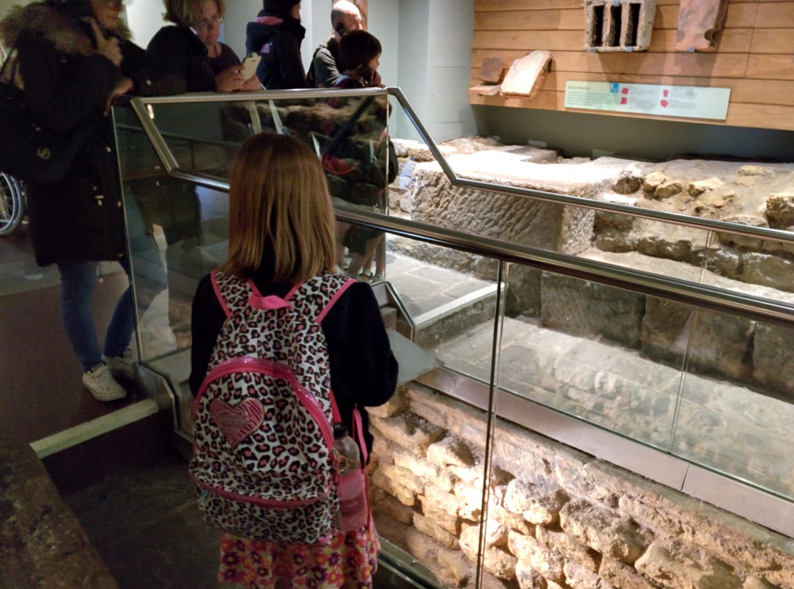 Looking down at the Roman ruins under glass in Bath