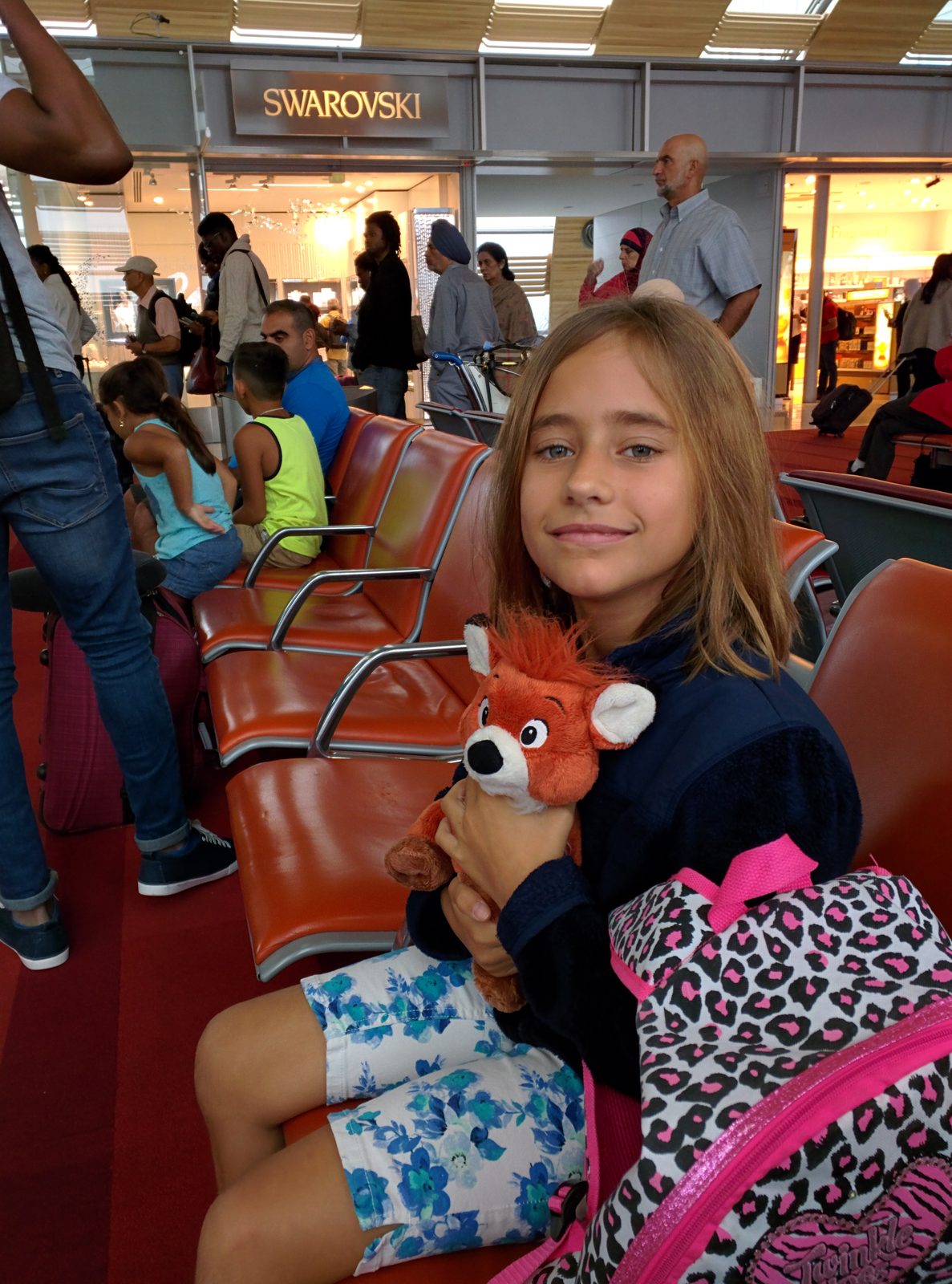 Lisa waiting at the gate with her stuffed fox