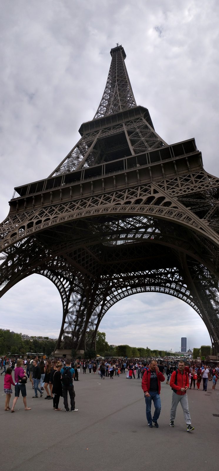 Standing under the Eiffel Tower