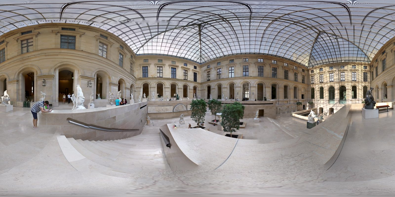 A glass-roofed court at the Louvre
