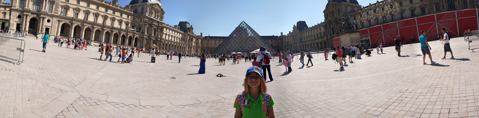 Lisa in the courtyard by the Louvre pyramid